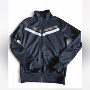Nike track jacket.Black with white and taupe/grey stripes. Women’s size Medium.